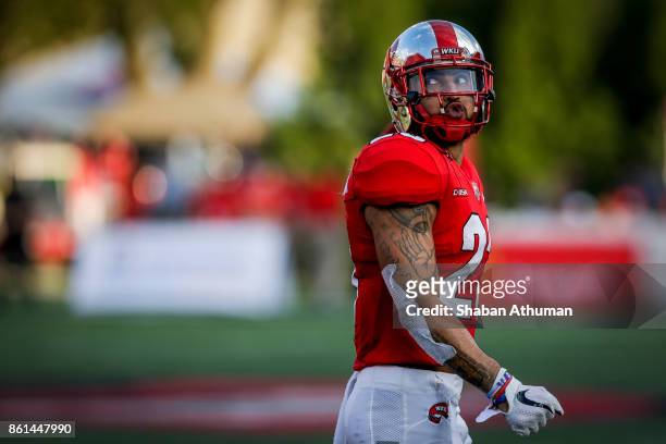 Wide Receiver Cameron Echols-Luper of the Western Kentucky Hilltoppers walks back to his bench after catching a touchdown pass that was called back...