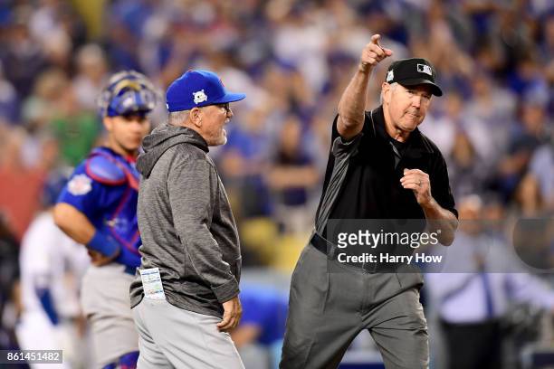 Joe Maddon of the Chicago Cubs is ejected by Mike Winters during the seventh inning against the Los Angeles Dodgers in Game One of the National...