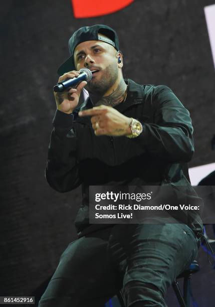 In this handout photo provided by One Voice: Somos Live!, Nicky Jam performs onstage at One Voice: Somos Live! A Concert For Disaster Relief at...