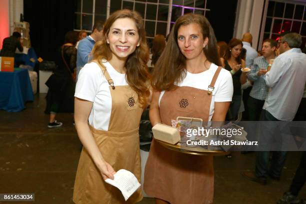 Waitresses serving guests during Street Eats hosted by Ghetto Gastro at Industria on October 14, 2017 in New York City.