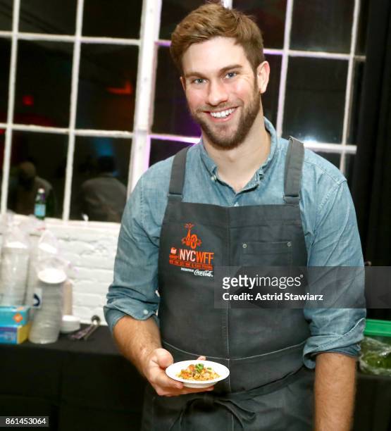 Adam Lathan, Co-Founder and Executive Chef at The Gumbo Bros poses with his dish, Crawfish Etouffee during Street Eats hosted by Ghetto Gastro at...