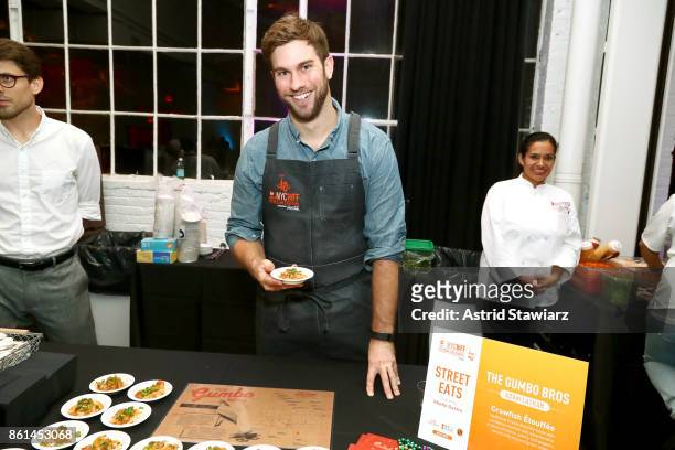 Adam Lathan, Co-Founder and Executive Chef at The Gumbo Bros poses with his dish, Crawfish Etouffee during Street Eats hosted by Ghetto Gastro at...