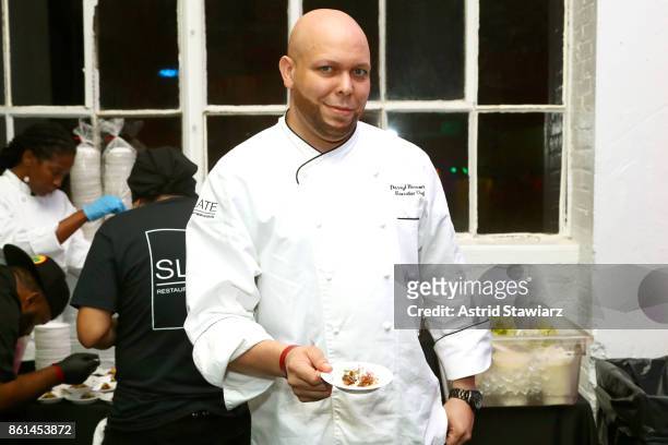 Chef Darryl Harmon poses with his dish, Short Rib Tostada, during Street Eats hosted by Ghetto Gastro at Industria on October 14, 2017 in New York...