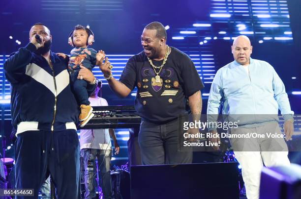 In this handout photo provided by One Voice: Somos Live!, DJ Khaled speaks onstage with his son Asahd Tuck Khaled, Busta Rhymes and Fat Joe at One...