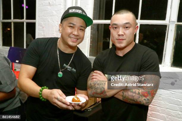Chefs Randy Lee and Christopher Wong pose with their dish, Dynamite Mac, served during Street Eats hosted by Ghetto Gastro at Industria on October...