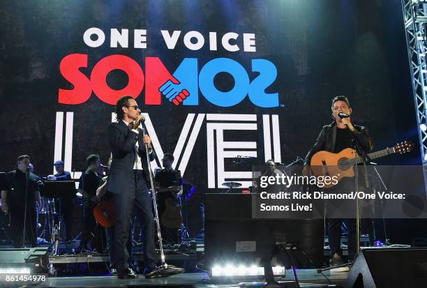 In this handout photo provided by One Voice: Somos Live!, Marc Anthony and Alejandro Sanz perform onstage at One Voice: Somos Live! A Concert For...