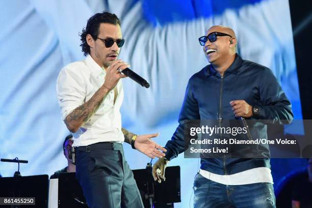 In this handout photo provided by One Voice: Somos Live!, Marc Anthony and Alexander Delgado perform onstage at One Voice: Somos Live! A Concert For...