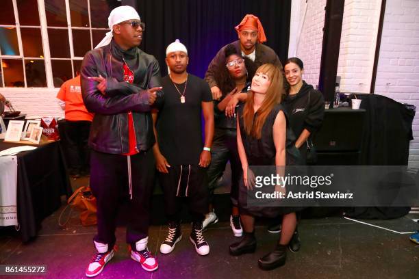 Hosts, musicians, and chefs Ghetto Gastro pose with guests during Street Eats hosted by Ghetto Gastro at Industria on October 14, 2017 in New York...
