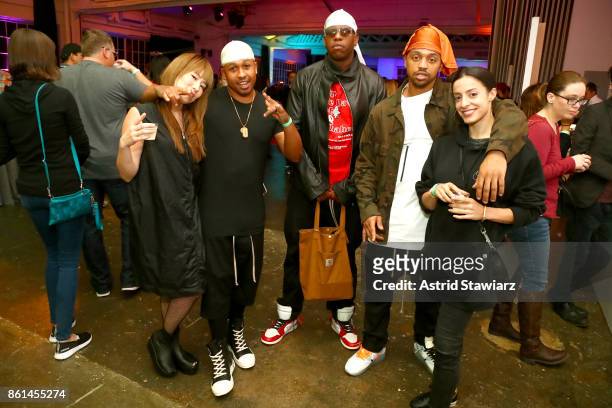 Hosts, musicians, and chefs Ghetto Gastro pose with guests during Street Eats hosted by Ghetto Gastro at Industria on October 14, 2017 in New York...