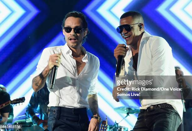 In this handout photo provided by One Voice: Somos Live!, Marc Anthony and Randy Malcom Martinez perform onstage at One Voice: Somos Live! A Concert...