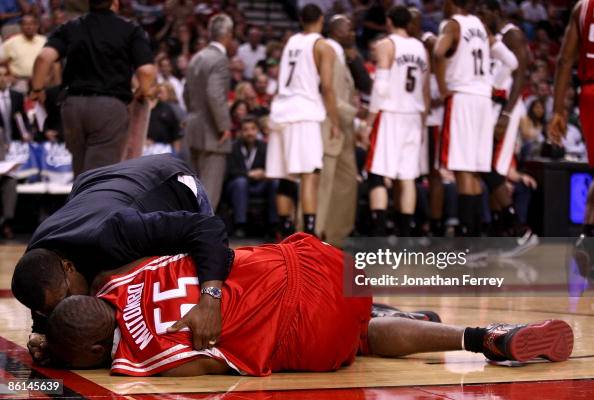 Mutamba Houston Rockets Dikembe Mutombo of the Houston Rockets lies in pain after an injury ...