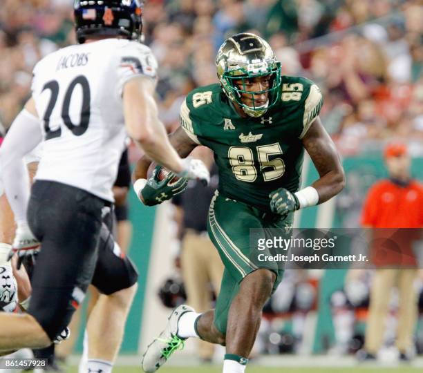Tight end Elkanah Dillon of the South Florida Bullsruns down the center of the field after catching a pass against the Cincinnati Bearcats during the...