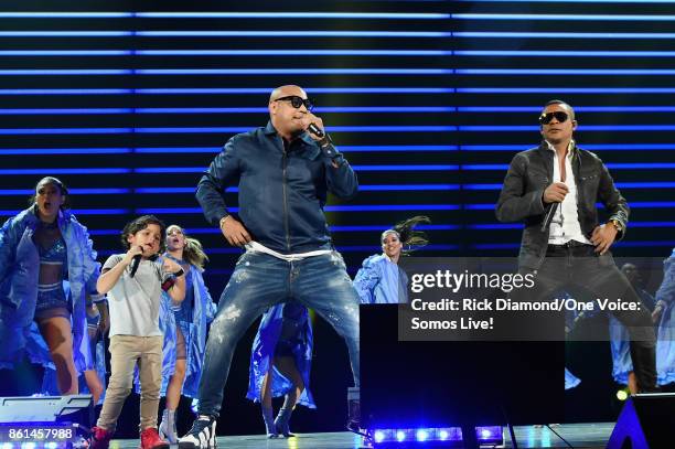 In this handout photo provided by One Voice: Somos Live!, Alexander Delgado and Randy Malcom Martinez of Gente de Zona perform onstage at One Voice:...