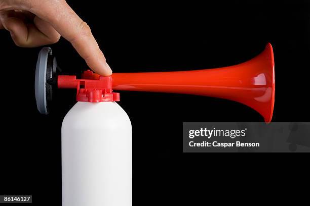 a human finger using an air horn - horn press stock pictures, royalty-free photos & images