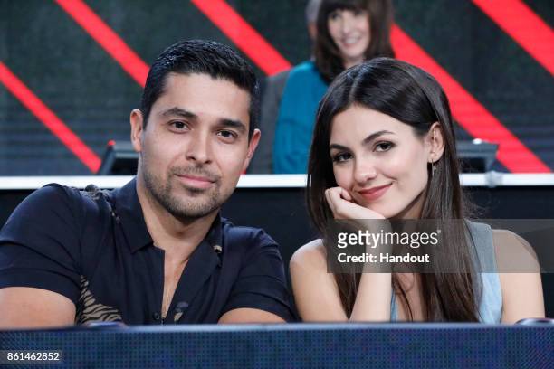 In this handout photo provided by One Voice: Somos Live!, Wilmer Valderrama and Victoria Justice participate in the phone bank during "One Voice:...