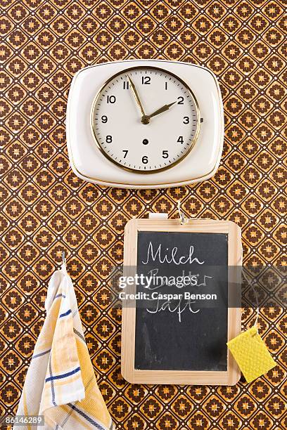 a wall clock, dish towel and chalkboard, still life - dish towel bildbanksfoton och bilder