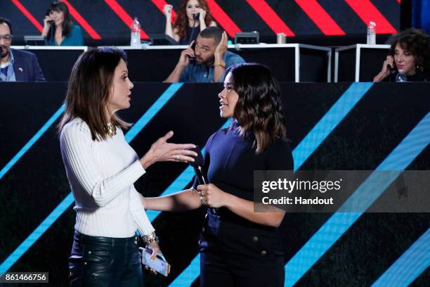 In this handout photo provided by One Voice: Somos Live!, Bethenny Frankel and Gina Rodriguez participate in the phone bank during "One Voice: Somos...