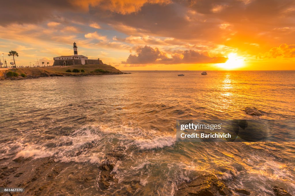 Sunset at the Barra's Lighthouse and beach in Salvador, Bahia.