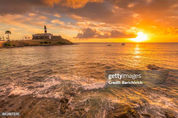 sunset at the barra's lighthouse and beach in salvador, bahia. - salvador stock pictures, royalty-free photos & images