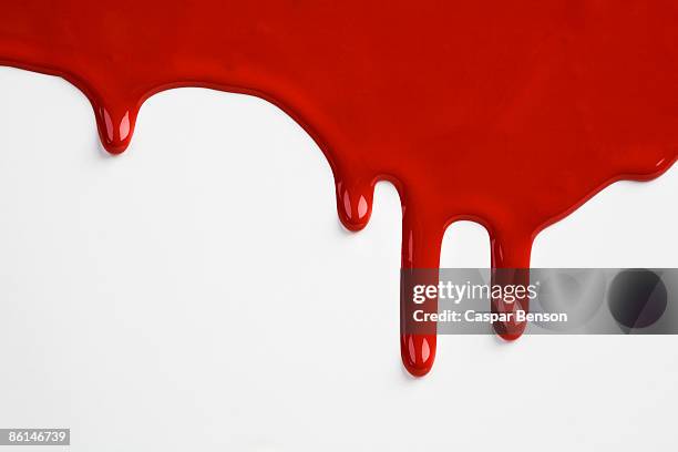 red paint dripping down a white wall - gota fotografías e imágenes de stock