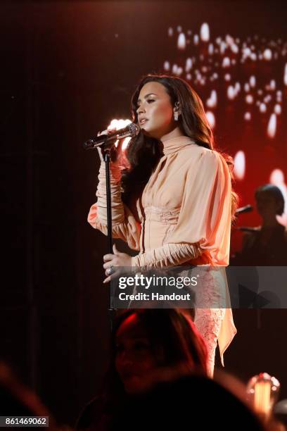 In this handout photo provided by One Voice: Somos Live!, Demi Lovato performs onstage during "One Voice: Somos Live! A Concert For Disaster Relief"...