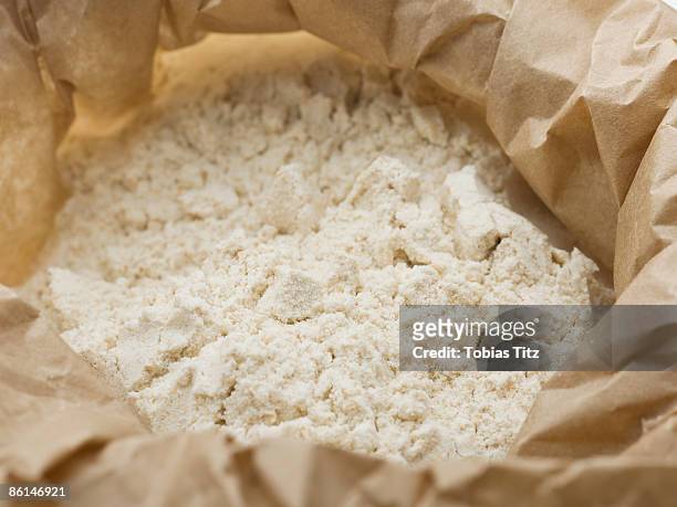 flour in a paper bag - flour stock pictures, royalty-free photos & images