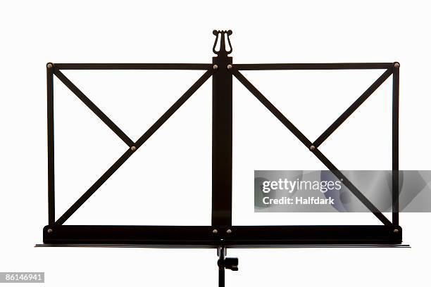 a music stand with a lyre symbol - notenständer stock-fotos und bilder