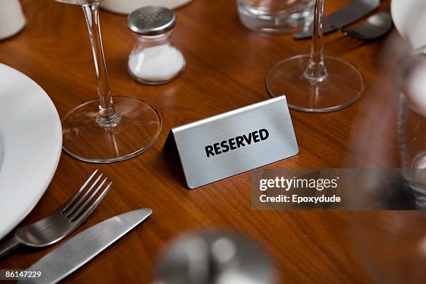 reserved sign on a dining table - reserved sign stock pictures, royalty-free photos & images