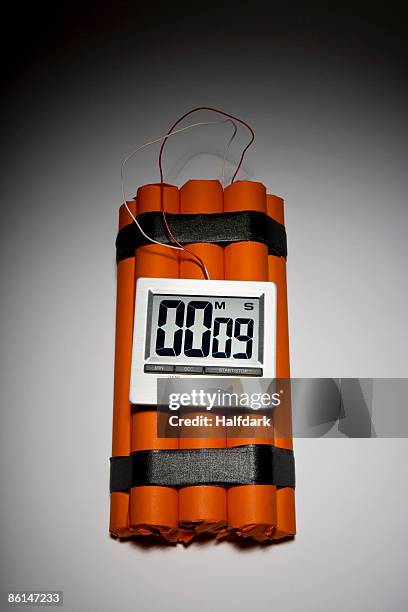 a dynamite time bomb with 9 seconds left on the timer - bomb countdown timer stockfoto's en -beelden