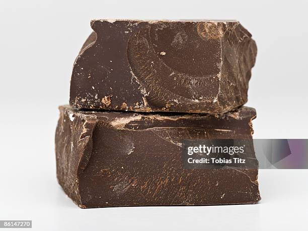 two pieces of dark chocolate - dark chocolate on white stock pictures, royalty-free photos & images