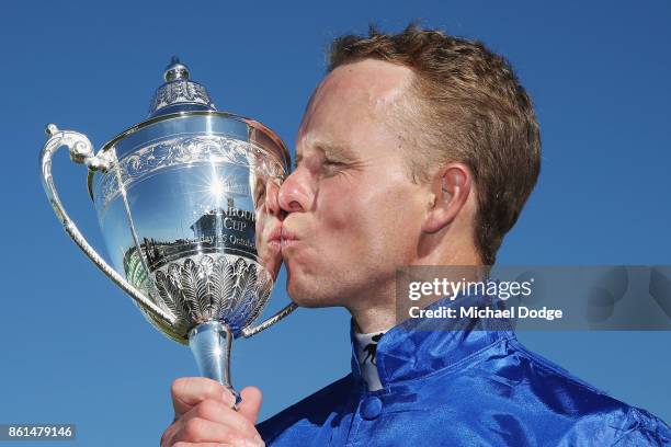 Jockey Kerrin McEvoy kisses his trophy after riding Folkswood to win race 8 the TAB Cranbourne Cup during Cranbourne Cup Day at on October 15, 2017...