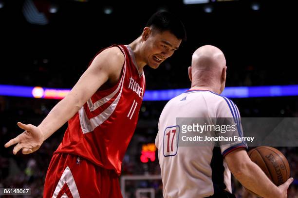 Yao Ming of the Houston Rockets argues a call with referee Joe Crawford during Game 2 of the Western Conference Quarterfinals against the Portland...