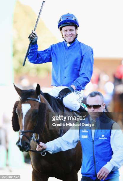 Jockey Kerrin McEvoy celebrates after riding Folkswood to win race 8 the TAB Cranbourne Cup during Cranbourne Cup Day at on October 15, 2017 in...