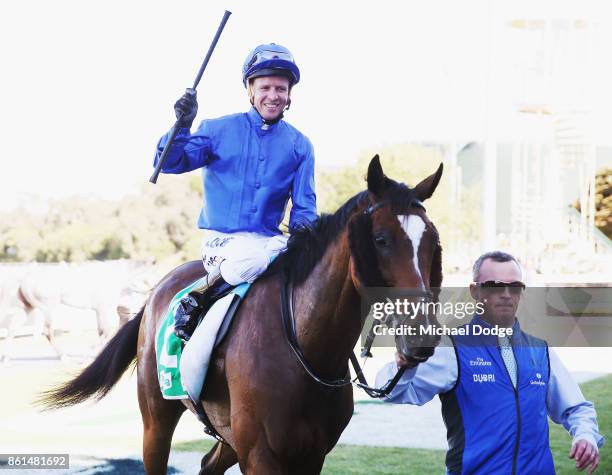 Jockey Kerrin McEvoy celebrates after riding Folkswood to win race 8 the TAB Cranbourne Cup during Cranbourne Cup Day at on October 15, 2017 in...