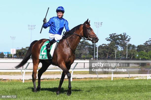 Jockey Kerrin McEvoy celebrates after riding Folkswood to win race 8 the TAB Cranbourne Cup during Cranbourne Cup Day at on October 15, 2017 in...