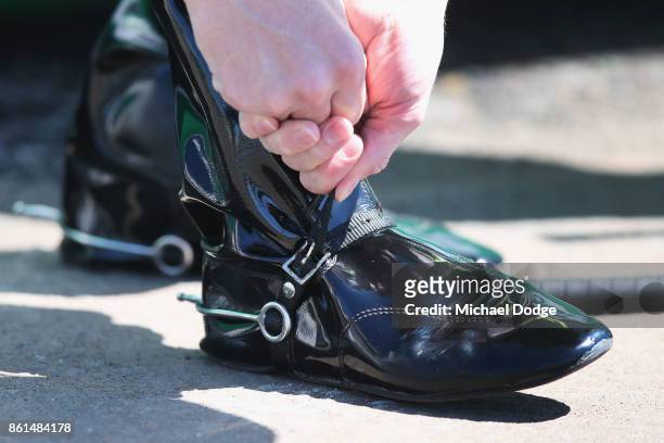 Damian Lane tightens up his straps during Cranbourne Cup Day at on October 15, 2017 in Cranbourne, Australia.