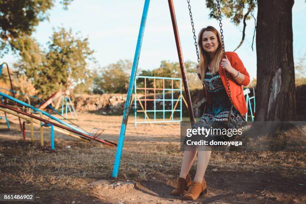 beautiful woman swinging on the swining chair - swining stock pictures, royalty-free photos & images