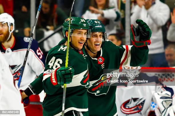 Minnesota Wild defenseman Jared Spurgeon and left wing Tyler Ennis celebrate after Ennis scored in the 3rd period during the regular season game...