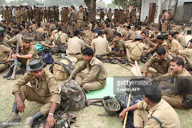 Indian paramilitary personnel wait for their movement order at an election material distribution center in Agartala, capital of the northeastern...
