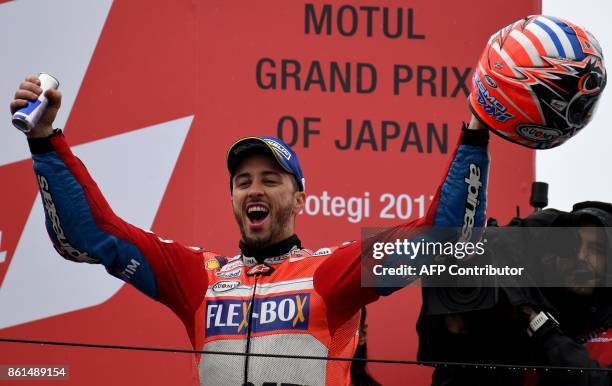 MotoGP class winner Ducati rider Andrea Dovizioso of Italy celebrate his victory on the podium during the MotoGP Japanese Grand Prix at Twin Ring...