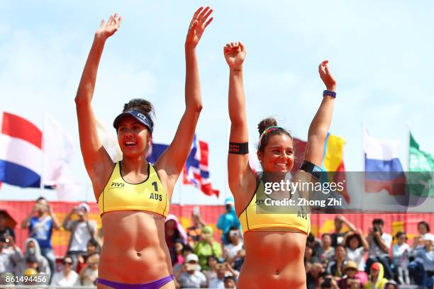 Mariafe Artacho and Taliqua Clancy of Australia react after winning the final match against Kinga Kolosinska and Katarzyna Kociolek of Poland on Day...