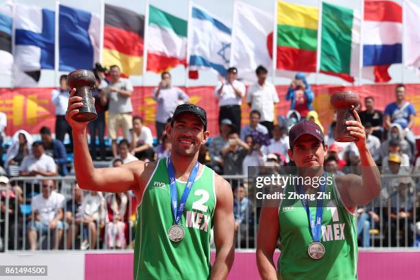 Juan Virgen and Lombardo Ontiveros of Mexico with their trophy after the final match against Maxim Sivolap and Igor Velichko of Russia on Day 5 of...