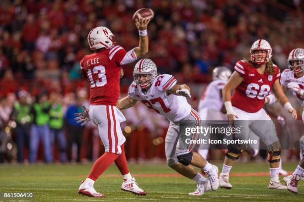 Ohio State Buckeyes defensive lineman Nick Bosa makes Nebraska Cornhuskers quarterback Tanner Lee hurry his pass on October 14, 2017 at Memorial...