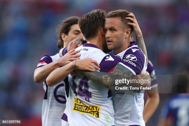 Adam Taggart of the Glory celebrates with teammates during the round two A-League match between the Newcastle Jets and the Perth Glory at McDonald...