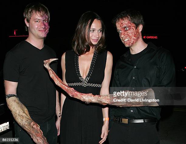 Actress Anna Walton poses with 'mutant' performers at the 'Mutant Chronicles' premiere after party at Napa Valley Grille on April 21, 2009 in...