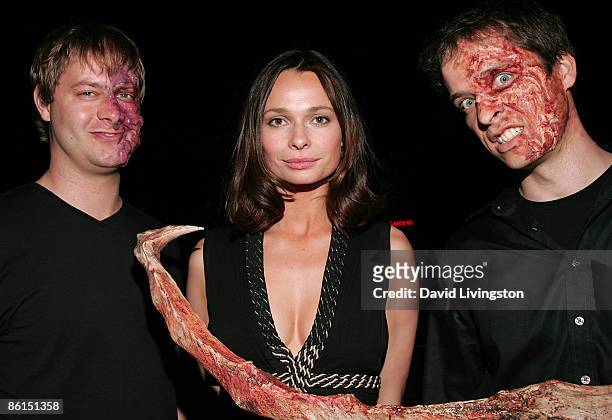 Actress Anna Walton poses with 'mutant' performers at the 'Mutant Chronicles' premiere after party at Napa Valley Grille on April 21, 2009 in...