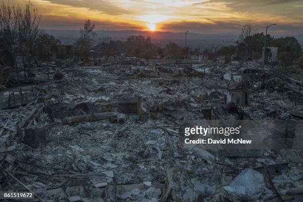 The ruins of houses destroyed by the Tubbs Fire are seen near Fountaingrove Parkway on October 14, 2017 in Santa Rosa, California. At least 40 people...