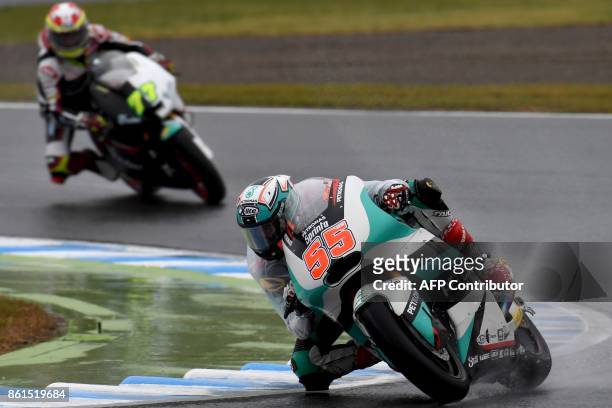 Kalex rider Hafizh Syahrin of Malaysia leads Suter rider Dominique Aegerter of Switzerland during the Moto2-class of the MotoGP Japanese Grand Prix...