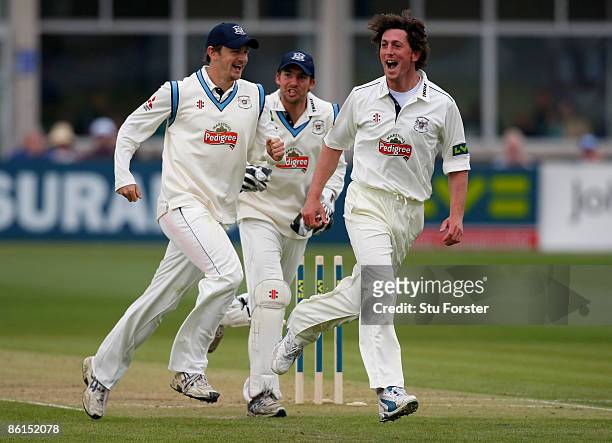 Gloucestershire bowler Jon Lewis and captain Alex Gidman celebrate after the wicket of Essex batsman Mark Pettini had been run out during the second...