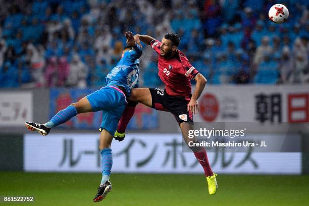Kyosuke Tagawa of Sagan Tosu and Matej Jonjic of Cerezo Osaka compete for the ball during the J.League J1 match between Sagan Tosu and Cerezo Osaka...